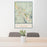 24x36 Snoqualmie Washington Map Print Portrait Orientation in Woodblock Style Behind 2 Chairs Table and Potted Plant
