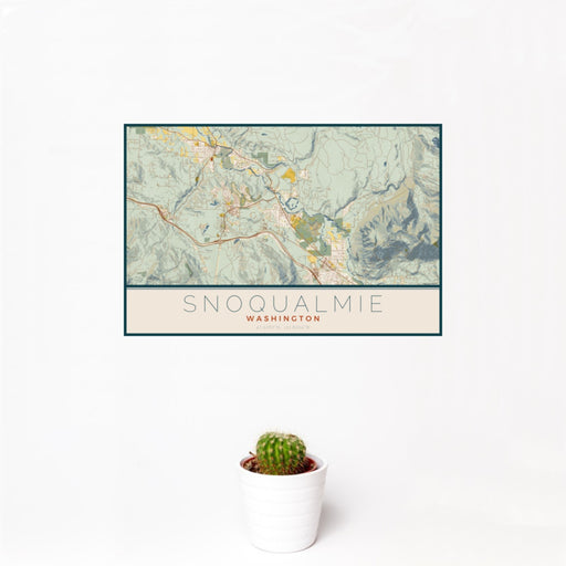 12x18 Snoqualmie Washington Map Print Landscape Orientation in Woodblock Style With Small Cactus Plant in White Planter