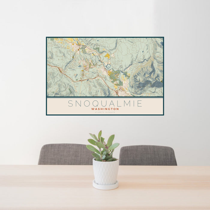 24x36 Snoqualmie Washington Map Print Landscape Orientation in Woodblock Style Behind 2 Chairs Table and Potted Plant