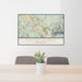 24x36 Snoqualmie Washington Map Print Landscape Orientation in Woodblock Style Behind 2 Chairs Table and Potted Plant