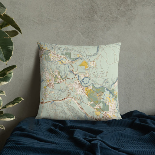 Custom Snoqualmie Washington Map Throw Pillow in Woodblock on Bedding Against Wall