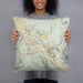 Person holding 18x18 Custom Snoqualmie Washington Map Throw Pillow in Woodblock