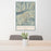 24x36 Snowbird Utah Map Print Portrait Orientation in Woodblock Style Behind 2 Chairs Table and Potted Plant
