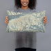 Person holding 20x12 Custom Snowbird Utah Map Throw Pillow in Woodblock