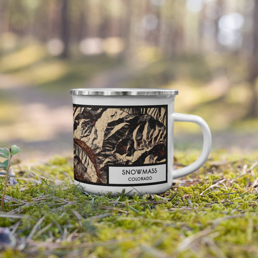 Right View Custom Snowmass Colorado Map Enamel Mug in Ember on Grass With Trees in Background