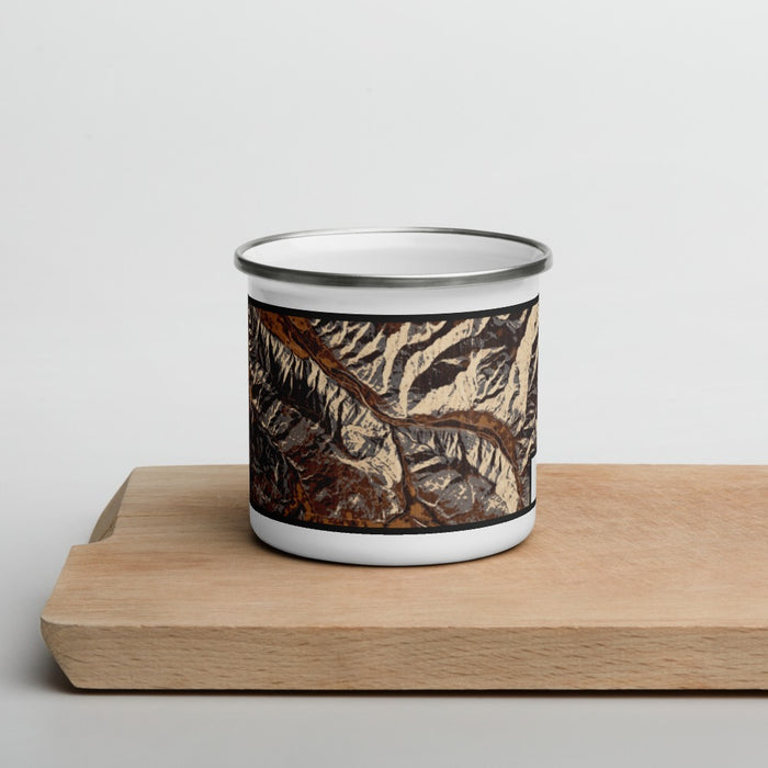 Front View Custom Snowmass Colorado Map Enamel Mug in Ember on Cutting Board