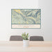 24x36 Snowmass Colorado Map Print Landscape Orientation in Woodblock Style Behind 2 Chairs Table and Potted Plant
