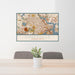 24x36 Somerville Massachusetts Map Print Landscape Orientation in Woodblock Style Behind 2 Chairs Table and Potted Plant