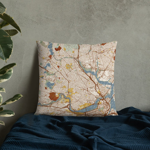 Custom Somerville Massachusetts Map Throw Pillow in Woodblock on Bedding Against Wall