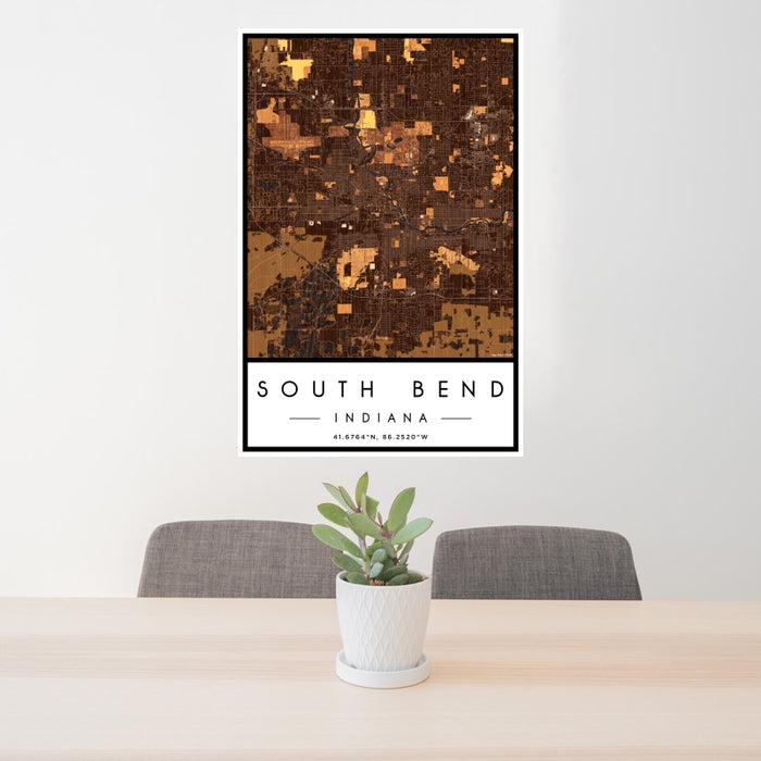 24x36 South Bend Indiana Map Print Portrait Orientation in Ember Style Behind 2 Chairs Table and Potted Plant