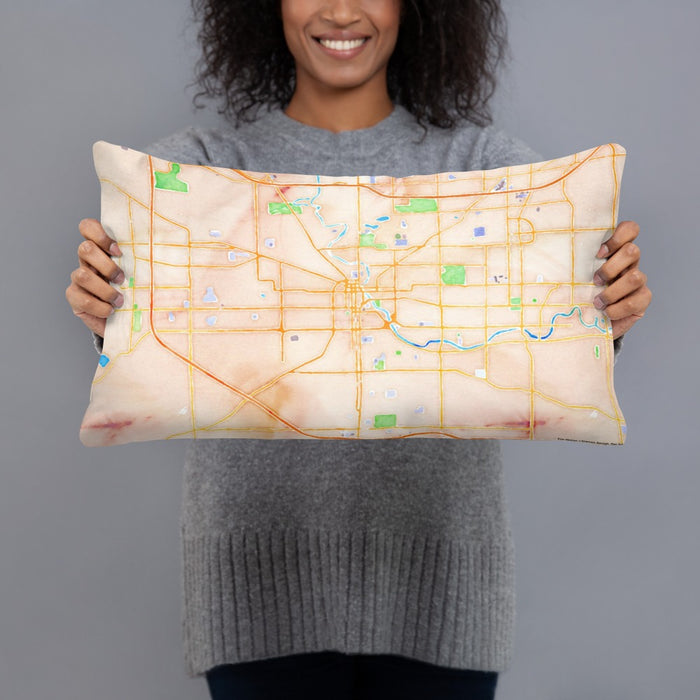 Person holding 20x12 Custom South Bend Indiana Map Throw Pillow in Watercolor
