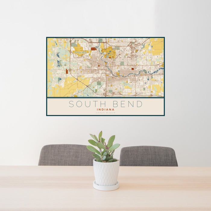 24x36 South Bend Indiana Map Print Landscape Orientation in Woodblock Style Behind 2 Chairs Table and Potted Plant