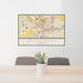 24x36 South Bend Indiana Map Print Landscape Orientation in Woodblock Style Behind 2 Chairs Table and Potted Plant
