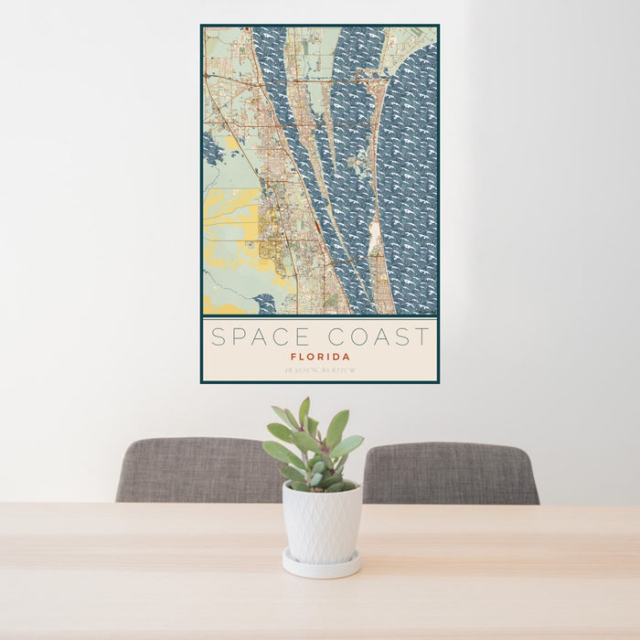 24x36 Space Coast Florida Map Print Portrait Orientation in Woodblock Style Behind 2 Chairs Table and Potted Plant