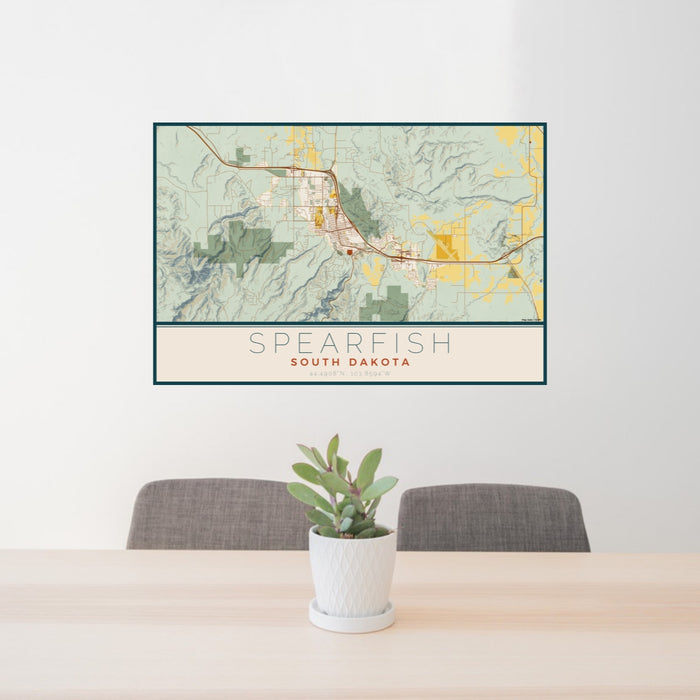 24x36 Spearfish South Dakota Map Print Lanscape Orientation in Woodblock Style Behind 2 Chairs Table and Potted Plant