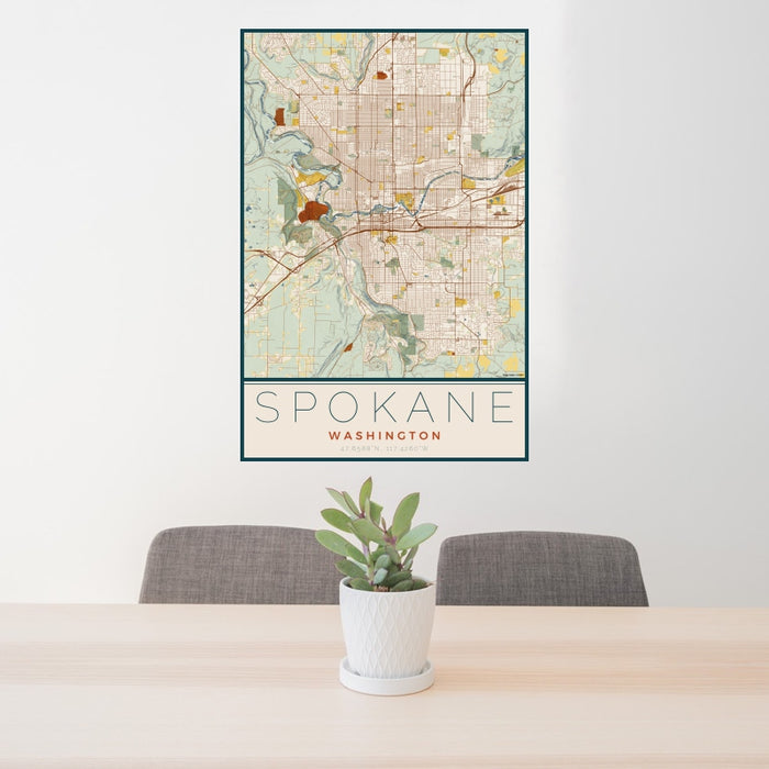 24x36 Spokane Washington Map Print Portrait Orientation in Woodblock Style Behind 2 Chairs Table and Potted Plant