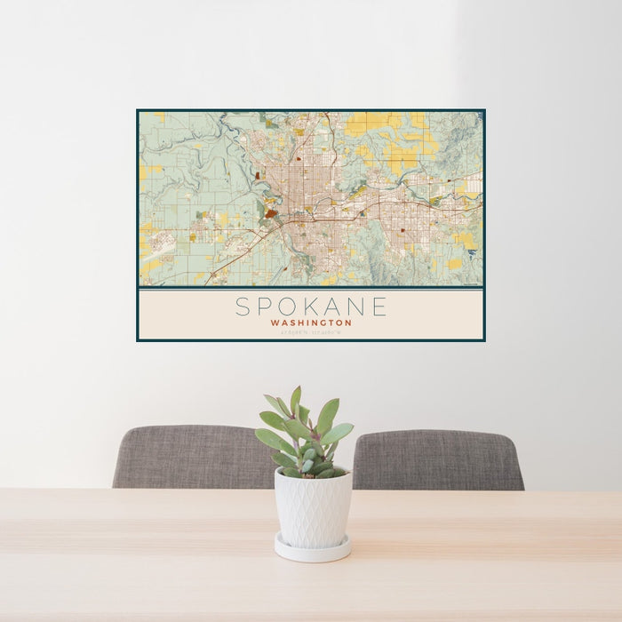 24x36 Spokane Washington Map Print Landscape Orientation in Woodblock Style Behind 2 Chairs Table and Potted Plant