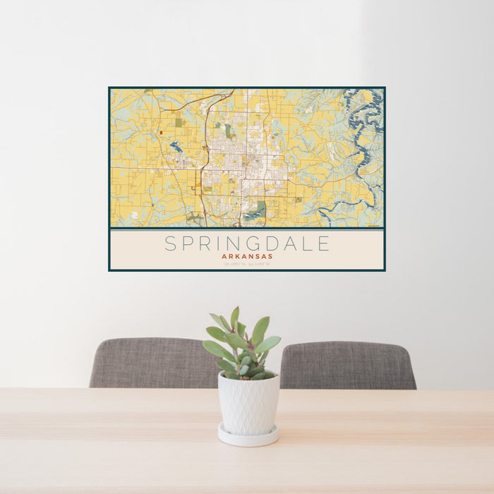 24x36 Springdale Arkansas Map Print Landscape Orientation in Woodblock Style Behind 2 Chairs Table and Potted Plant