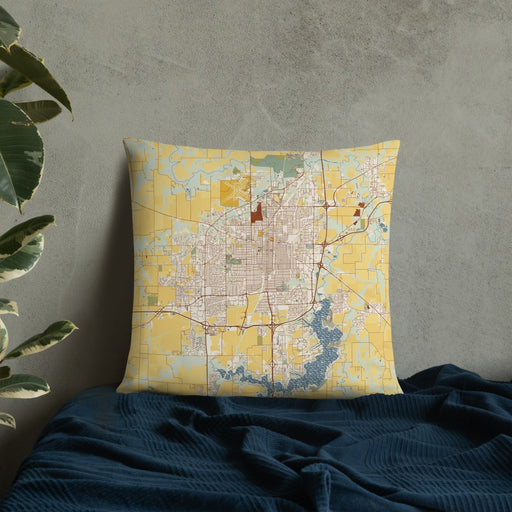Custom Springfield Illinois Map Throw Pillow in Woodblock on Bedding Against Wall