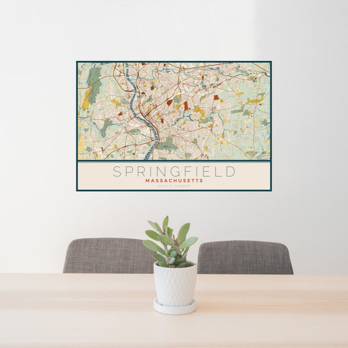 24x36 Springfield Massachusetts Map Print Landscape Orientation in Woodblock Style Behind 2 Chairs Table and Potted Plant