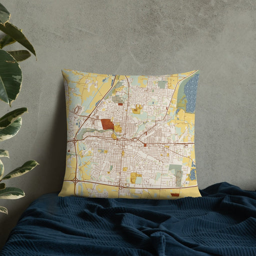 Custom Springfield Ohio Map Throw Pillow in Woodblock on Bedding Against Wall