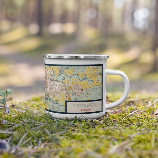 Right View Custom Springfield Oregon Map Enamel Mug in Woodblock on Grass With Trees in Background