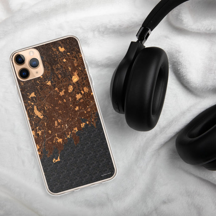 Custom Stamford Connecticut Map Phone Case in Ember on Table with Black Headphones