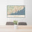 24x36 Stamford Connecticut Map Print Landscape Orientation in Woodblock Style Behind 2 Chairs Table and Potted Plant