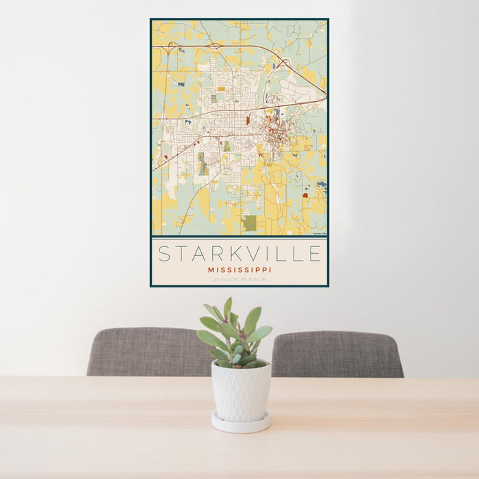 24x36 Starkville Mississippi Map Print Portrait Orientation in Woodblock Style Behind 2 Chairs Table and Potted Plant