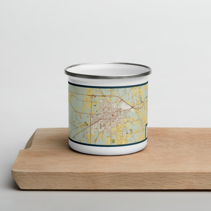 Front View Custom Starkville Mississippi Map Enamel Mug in Woodblock on Cutting Board