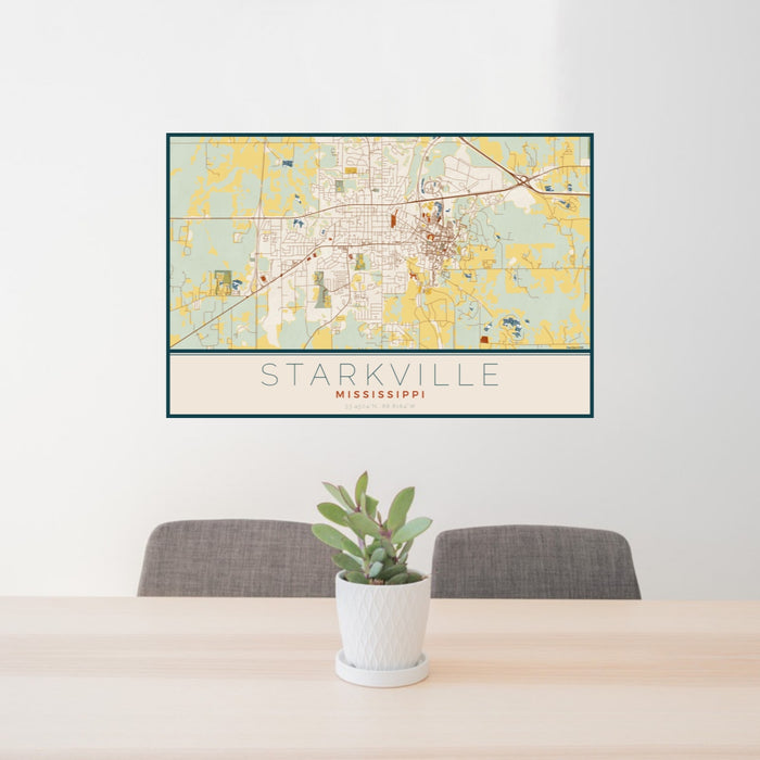 24x36 Starkville Mississippi Map Print Landscape Orientation in Woodblock Style Behind 2 Chairs Table and Potted Plant