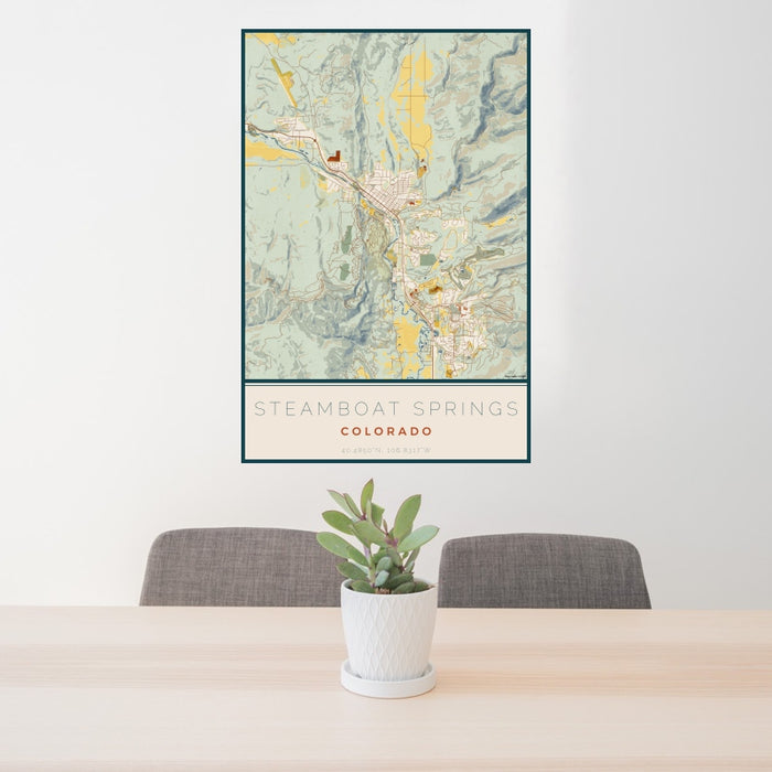 24x36 Steamboat Springs Colorado Map Print Portrait Orientation in Woodblock Style Behind 2 Chairs Table and Potted Plant