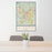 24x36 St. George Utah Map Print Portrait Orientation in Woodblock Style Behind 2 Chairs Table and Potted Plant
