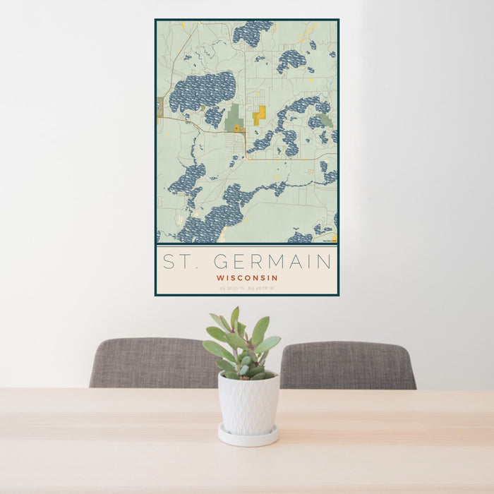24x36 St. Germain Wisconsin Map Print Portrait Orientation in Woodblock Style Behind 2 Chairs Table and Potted Plant