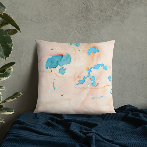 Custom St. Germain Wisconsin Map Throw Pillow in Watercolor on Bedding Against Wall