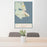 24x36 St. Ignace Michigan Map Print Portrait Orientation in Woodblock Style Behind 2 Chairs Table and Potted Plant