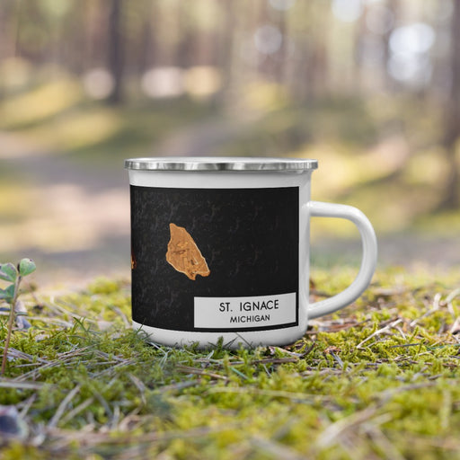 Right View Custom St. Ignace Michigan Map Enamel Mug in Ember on Grass With Trees in Background
