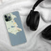 Custom St. Ignace Michigan Map Phone Case in Woodblock on Table with Black Headphones