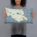 Person holding 20x12 Custom St. Ignace Michigan Map Throw Pillow in Woodblock