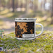 Right View Custom Stockbridge Massachusetts Map Enamel Mug in Ember on Grass With Trees in Background