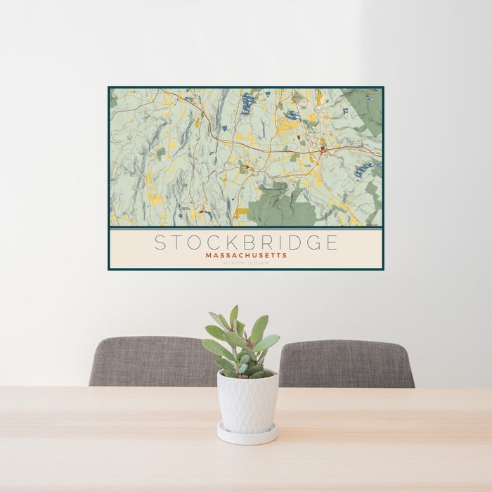 24x36 Stockbridge Massachusetts Map Print Landscape Orientation in Woodblock Style Behind 2 Chairs Table and Potted Plant