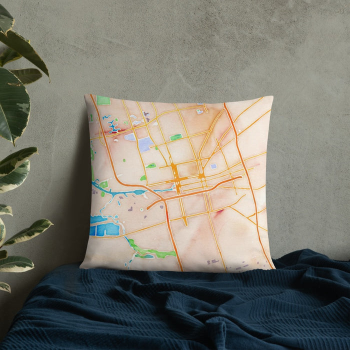 Custom Stockton California Map Throw Pillow in Watercolor on Bedding Against Wall