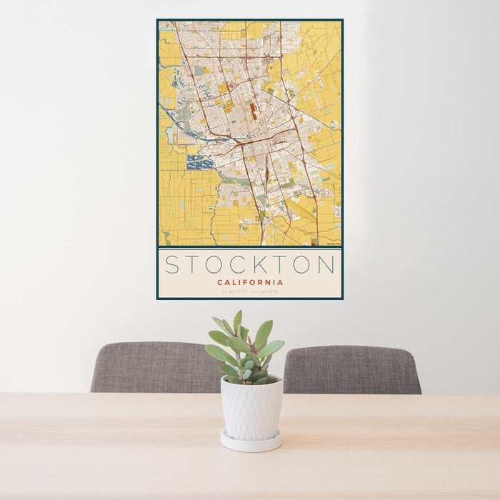 24x36 Stockton California Map Print Portrait Orientation in Woodblock Style Behind 2 Chairs Table and Potted Plant