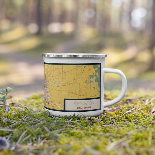 Right View Custom Stockton California Map Enamel Mug in Woodblock on Grass With Trees in Background