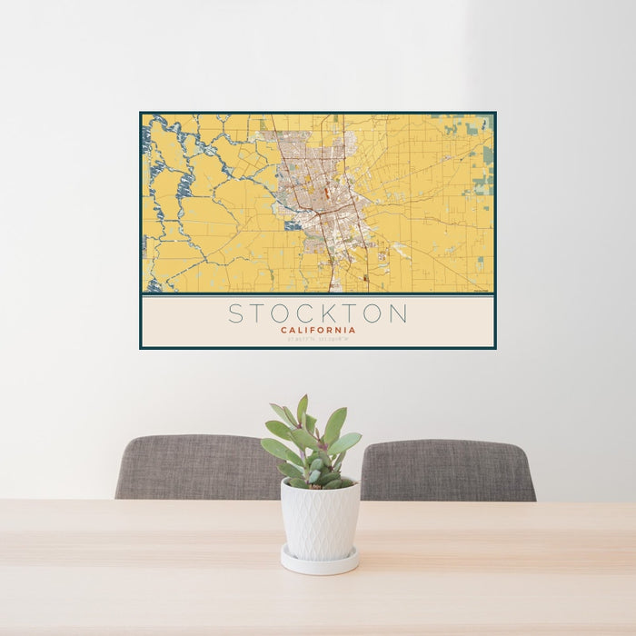 24x36 Stockton California Map Print Landscape Orientation in Woodblock Style Behind 2 Chairs Table and Potted Plant