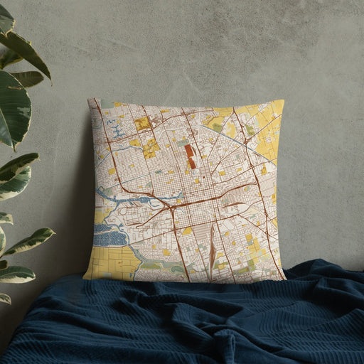 Custom Stockton California Map Throw Pillow in Woodblock on Bedding Against Wall