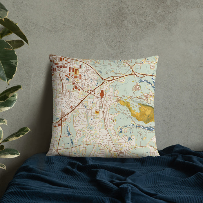 Custom Stone Mountain Georgia Map Throw Pillow in Woodblock on Bedding Against Wall