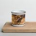 Front View Custom Stowe Vermont Map Enamel Mug in Ember on Cutting Board