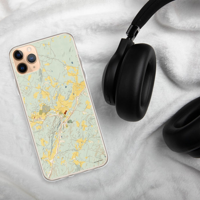 Custom Stowe Vermont Map Phone Case in Woodblock on Table with Black Headphones