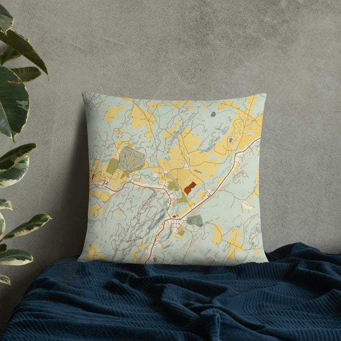 Custom Stowe Vermont Map Throw Pillow in Woodblock on Bedding Against Wall